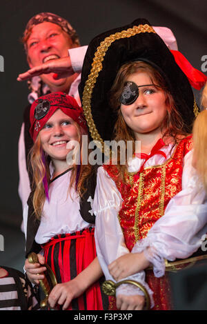 Tybee Island, Georgia. 10th Oct, 2015. Young girls in pirate costumes are voted on by the audience during the children's pirate contest during the annual three-day Tybee Island Pirate Festival October 10, 2015 in Tybee Island, Georgia. Stock Photo