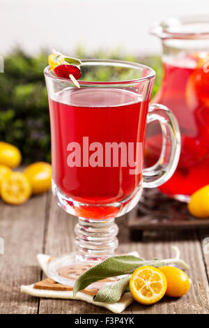 Cranberry and orange holiday punch with sage in a glass Stock Photo