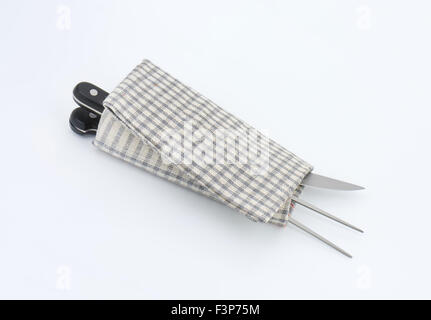 carving set wrapped in checkered dishtowel Stock Photo