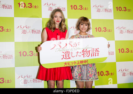 (L to R) American actress Amanda Seyfried and Japanese model, talent and singer IMALU pose for the cameras during a stage greeting for the film Fathers and Daughters on October 11, 2015, Tokyo, Japan. The movie was released in the Japanese theaters on October 3rd. © Rodrigo Reyes Marin/AFLO/Alamy Live News Stock Photo