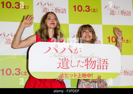 (L to R) American actress Amanda Seyfried and Japanese model, talent and singer IMALU greet to the cameras during a stage greeting for the film Fathers and Daughters on October 11, 2015, Tokyo, Japan. The movie was released in the Japanese theaters on October 3rd. © Rodrigo Reyes Marin/AFLO/Alamy Live News Stock Photo