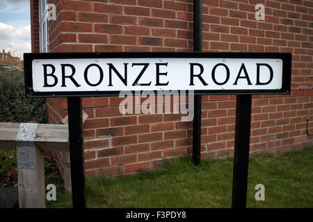 Bronze Road sign in Cawston village, Rugby, Warwickshire, England, UK Stock Photo