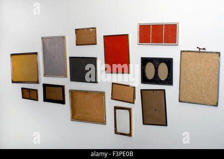 Empty frames on white wall Stock Photo