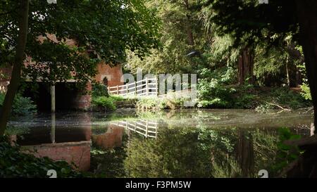 Reflection of boat house in lake Elvaston Castle Derby Stock Photo
