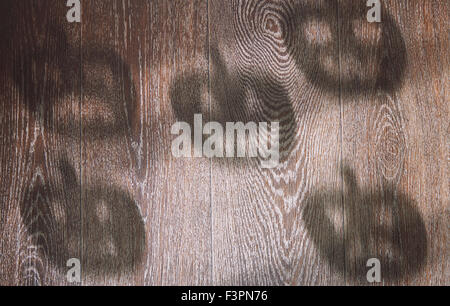 Shadows of Halloween pumpkins on a hardwood texture Stock Photo