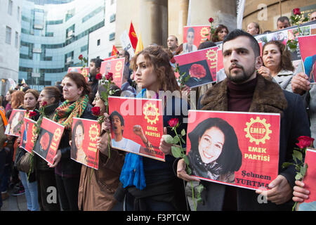 London, UK. 11/10/2015. Members of Emek Partisi (EMEP) hold up photos of people killed by the bombs in Ankara. Several thousand Kurds and Turks marched from Downing Street to the BBC headquarters at Langham Place, to protest against the bombs in Ankara that killed many people attending a peace demonstration. Credit:  Nick Savage/Alamy Live News Stock Photo