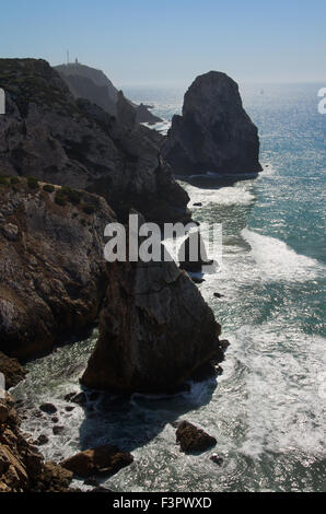 View of the cliffs of Cape Roca and the ocean surf during sunset ...