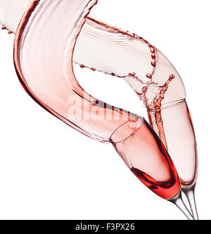red wine splashes from glasses isolated on white background. Stock Photo