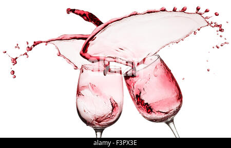 red wine splashes from two glasses isolated on the white background. Stock Photo