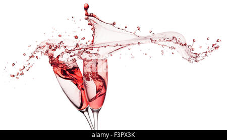 red wine splashes from glasses isolated on white background. Stock Photo