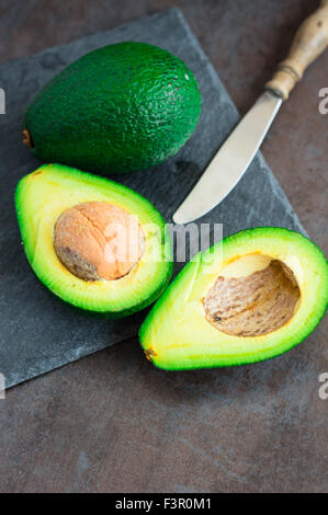 avocado on a dark wood background. tinting. selective focus Stock Photo