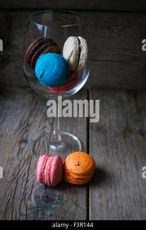 Colorful macaroons on old wooden background Stock Photo
