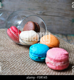 Colorful macaroons on old wooden background Stock Photo