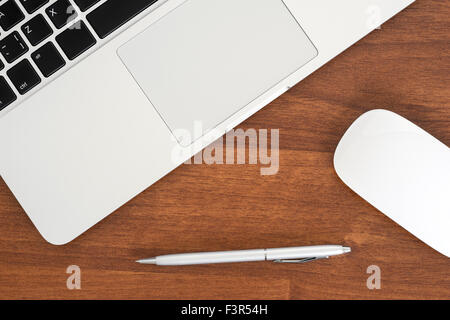 The laptop on the table close-up, top view Stock Photo