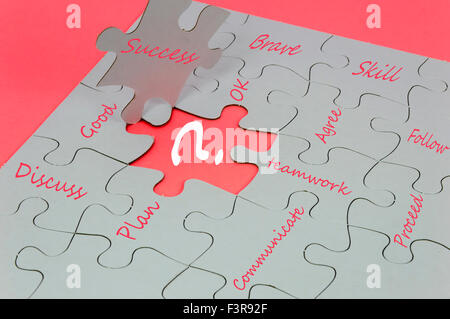 Business behavior language on white jigsaw puzzle Stock Photo
