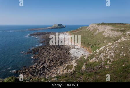Outgoing tide at the Worms Head Causeway on the Gower Peninsula, South Wales Stock Photo