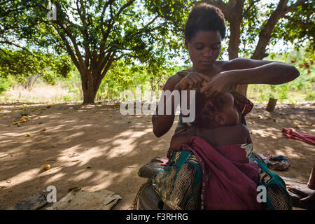 Traditional hairdresser in a village, Zambia, Africa Stock Photo