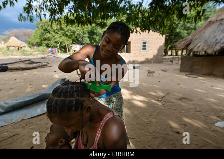 Traditional hairdresser in a village, Zambia, Africa Stock Photo