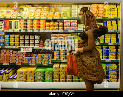 Woman of the Himba tribe in the supermarket, Opuwo, Namibia, Africa Stock Photo