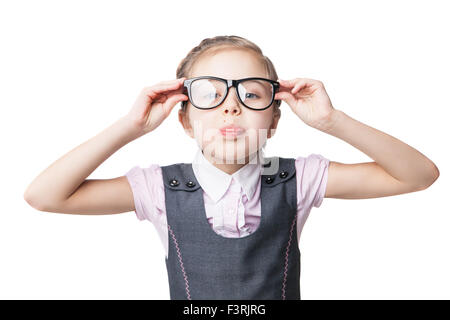 Funny little girl in glasses makes faces Stock Photo