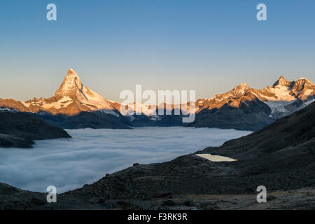 Matterhorn with clouds at sunrise, Switzerland Stock Photo