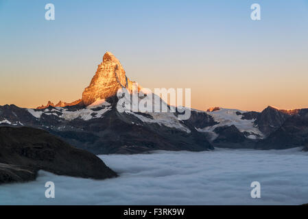 Matterhorn with clouds at sunrise, Switzerland Stock Photo