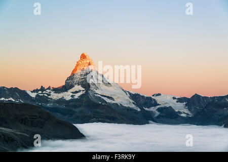 Matterhorn with clouds at sunrise, Switzerland Stock Photo