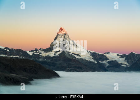 Matterhorn with clouds at sunrise, Switzerland Stock Photo