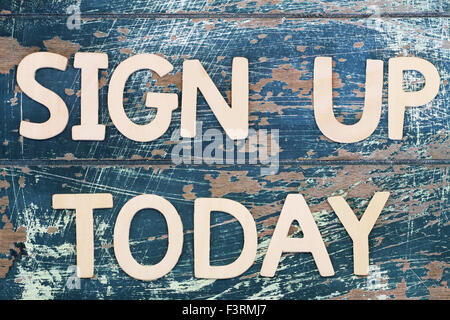 Sign up today written on rustic wooden surface Stock Photo