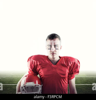 Composite image of a serious american football player looking at camera Stock Photo