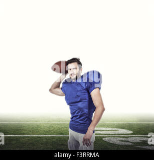 Composite image of american football player throwing the ball Stock Photo