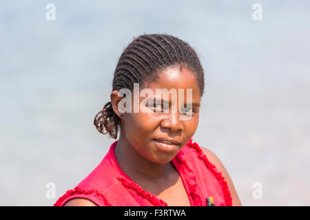 Head and shoulders portrait of a local young African Malawian woman with braided hair, Likoma Island, Lake Malawi, Malawi, south-east Africa Stock Photo