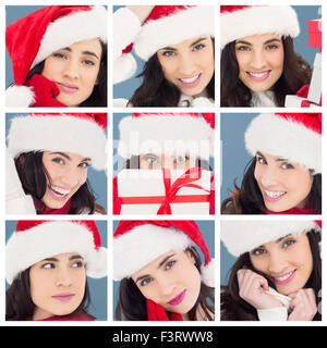 Composite image of unsure brunette in santa hat packing gifts Stock Photo