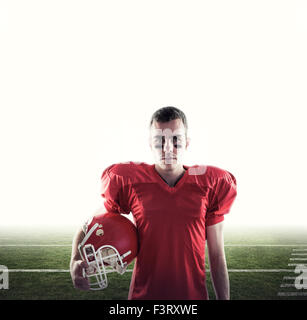 Composite image of a serious american football player looking at camera Stock Photo