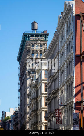 Cast-iron buildings in Soho in Lower Manhattan in New York City, one with an old water tower on the roof Stock Photo