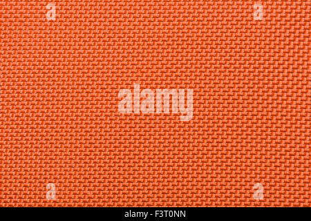 A macro shot of a very tightly woven orange fabric. Stock Photo