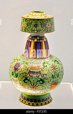 Imperial porcelain ritual vase with a lime-green ground and an intricate Fencai design of the Eight Auspicious Symbols, dating to the Qianlong Reign of the Qing Dynasty, exhibited at the Shanghai Museum. - Tibetan Vase with ( fencai Design of eight Alispicious Simbols on green ground Jingdezhen Ware 1736  - 1795 AD  Qianlong Reign ( Qing Dynasty ) Shanghai Museum of ancient Chinese art China Stock Photo