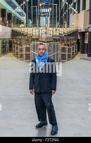 London, UK. 12th October, 2015. Abraham Cruzvillegas with his work - Tate Modern opens first Hyundai Commission by Abraham Cruzvillegas. The new sculpture, which fills the whole of Tate’s Turbine Hall is the first in a new series of annual site-specific commissions by renowned international artists. Abraham Cruzvillegas is best known for creating sculptural works from local objects and is one of the key figures in a new wave of artists in Mexico. The Hyundai Commission 2015: Abraham Cruzvillegas is at Tate Modern from 13 October 2015 - 3 April 2016. Credit:  Guy Bell/Alamy Live News Stock Photo