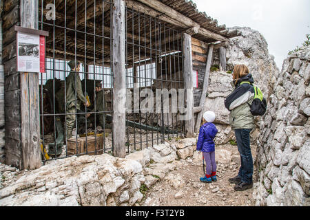 Italy Veneto Hikers observe the reconstruction of a military post on the  Cinque Torri Stock Photo