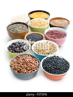 various legumes in bowls on white background Stock Photo