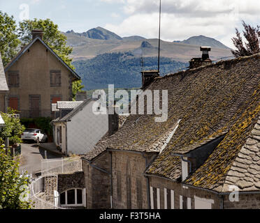 The town of La Tour d'Auvergne with Puy de Sancy and another extinct volcano in the background Stock Photo