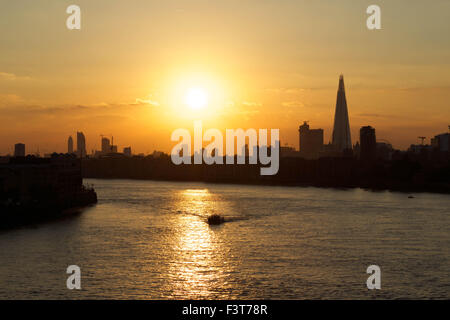 London, UK. 12th October, 2015. UK Weather: Beautiful satsuma orange sunset featuring River Thames and The Shard. Credit:  Glenn Sontag/Alamy Live News Stock Photo