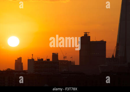 London, UK. 12th October, 2015. UK Weather: Beautiful satsuma orange sunset featuring River Thames and The Shard. Credit:  Glenn Sontag/Alamy Live News Stock Photo