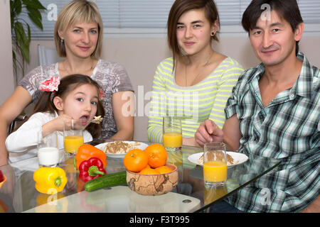 Breakfast of family with mix race different nationality people Stock Photo