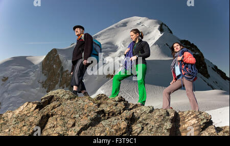 Three people family hike mountain