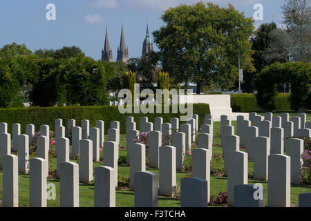 The British War Cemetary at Bayeux with spires of Bayeux Catherdral in background. Stock Photo