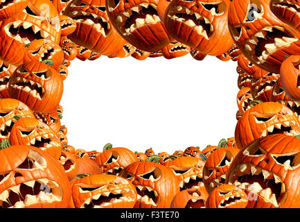 Halloween horizontal frame pumpkin harvest as a group of scary carved jackolantern monsters as a concept and symbol for a creepy advertisement and marketing announcement. Stock Photo