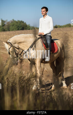 Attractive man on horseback, Stock Photo