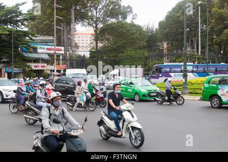 There are over 45 million scooters motorbikes in Vietnam.Typical scene from Ho Chi Minh ( Saigon) city centre with commuters. Stock Photo