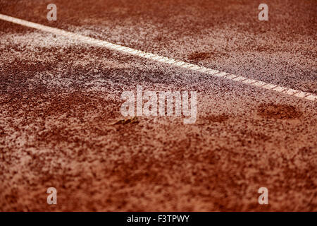 Detail shot with a wet tennis clay court Stock Photo